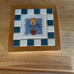 Decorative Tile with Birdhouse Design